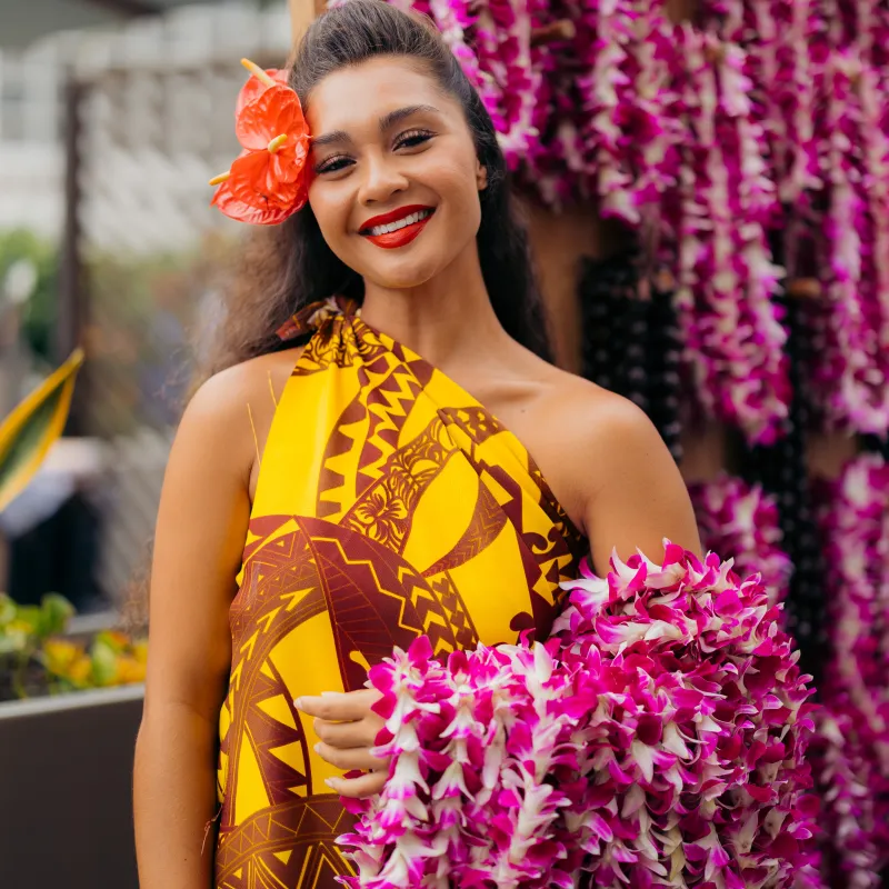 Dancer with orchid leis at Pa'ina Waikiki