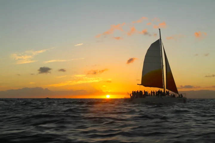 Holokai catamaran sailing into the sunset off Waikiki