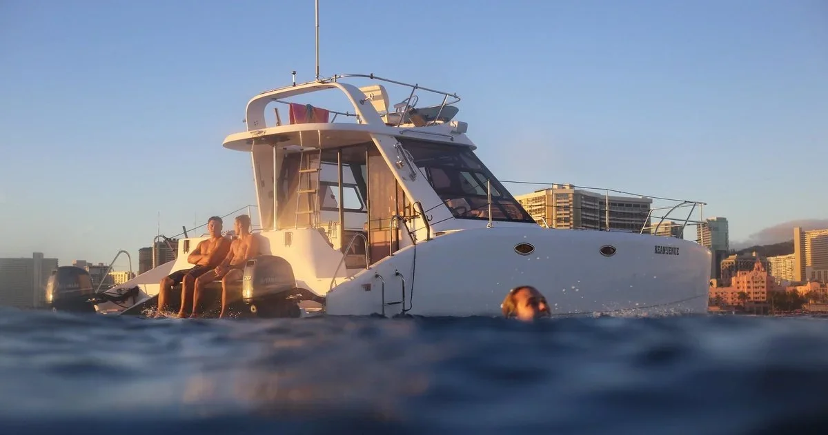 Keanuenue private catamaran off Waikiki at sunset