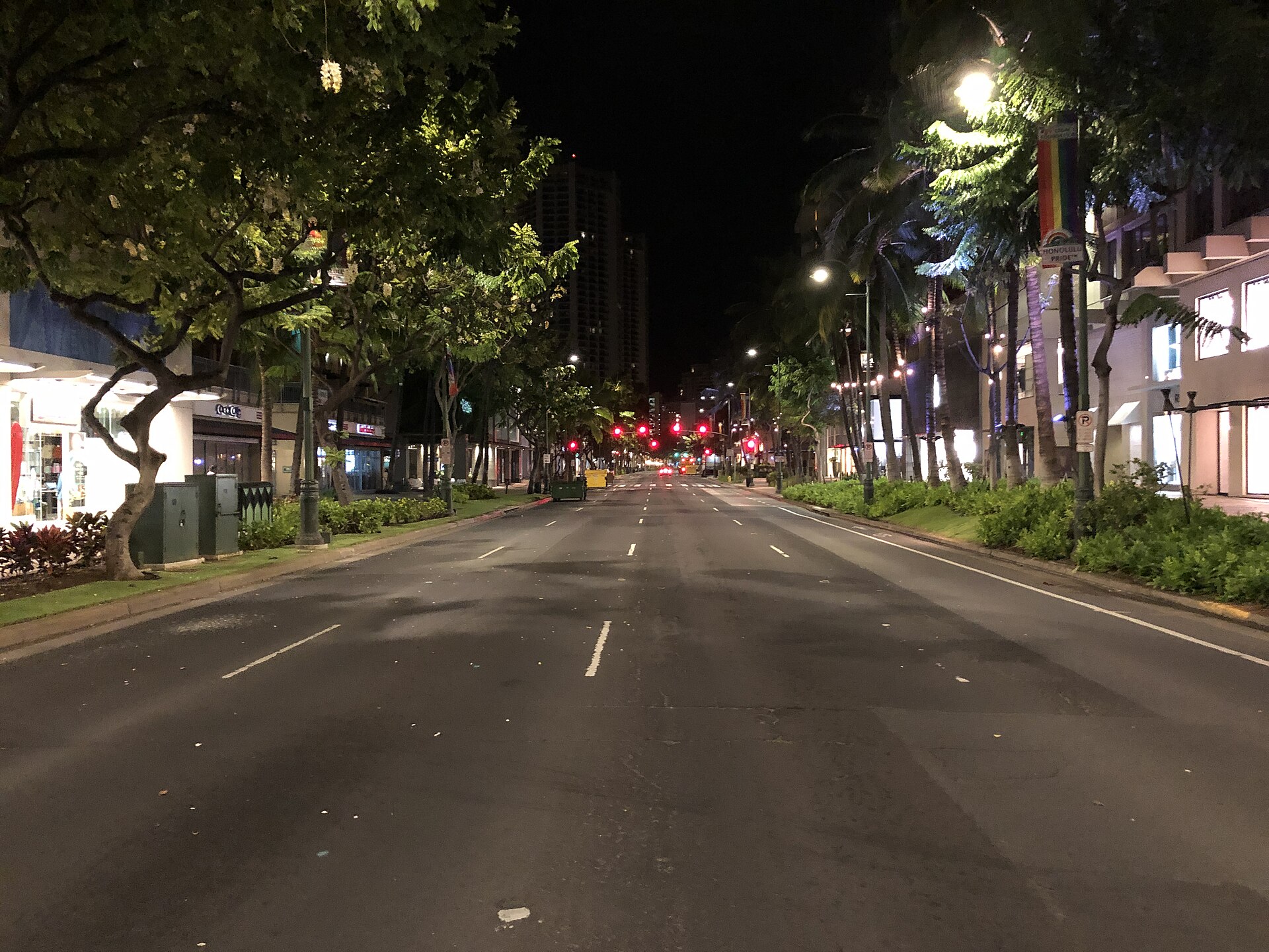 Kalākaua Avenue, Waikiki, Oahu — wide boulevard lined with palms during a cultural festival parade