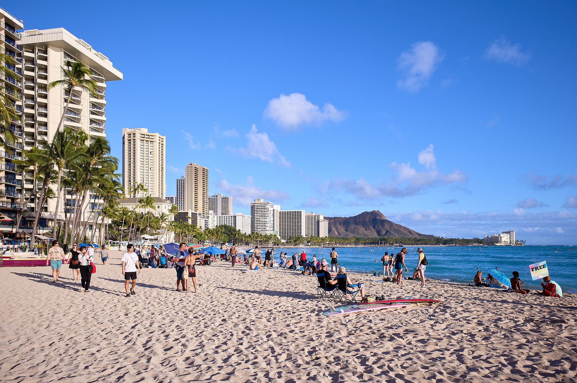 Waikīkī Beach, Oahu — turquoise water, surfers, and Diamond Head in the background