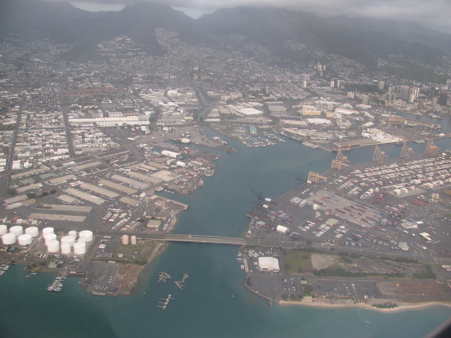 Honolulu Harbor, Oahu — waterfront and city skyline at dusk with fireworks