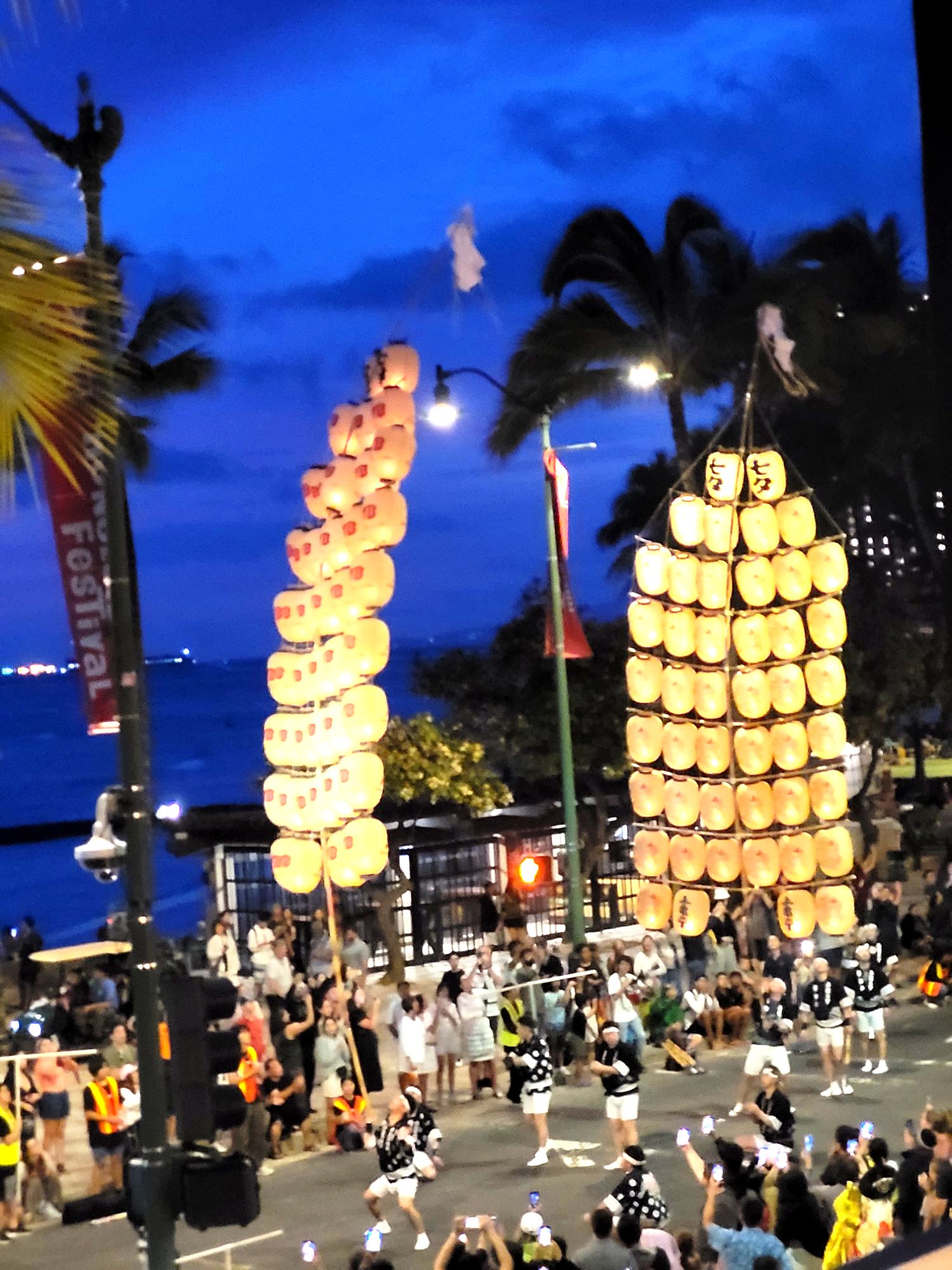 Glowing lantern towers at night at the Honolulu Festival 2026 Waikiki Hawaii